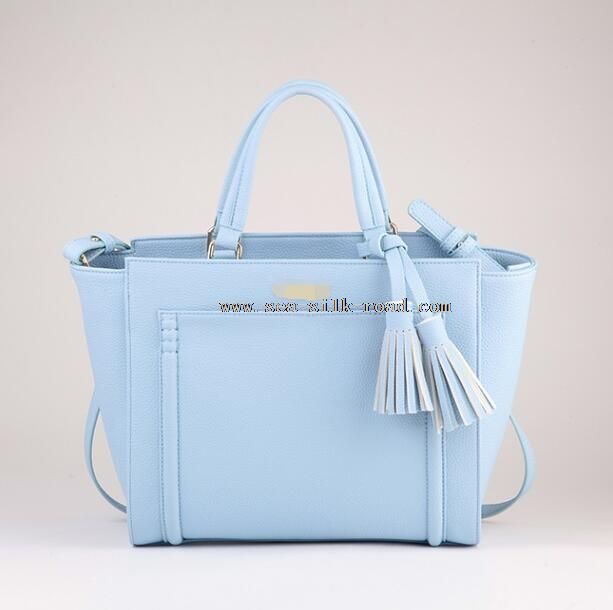 handbag with decorative tassel