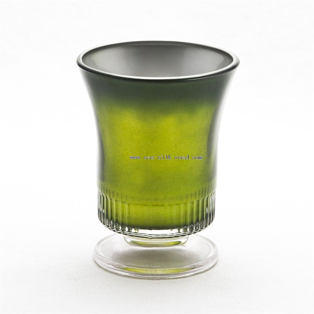 Zöld gyertyát tartó üveg