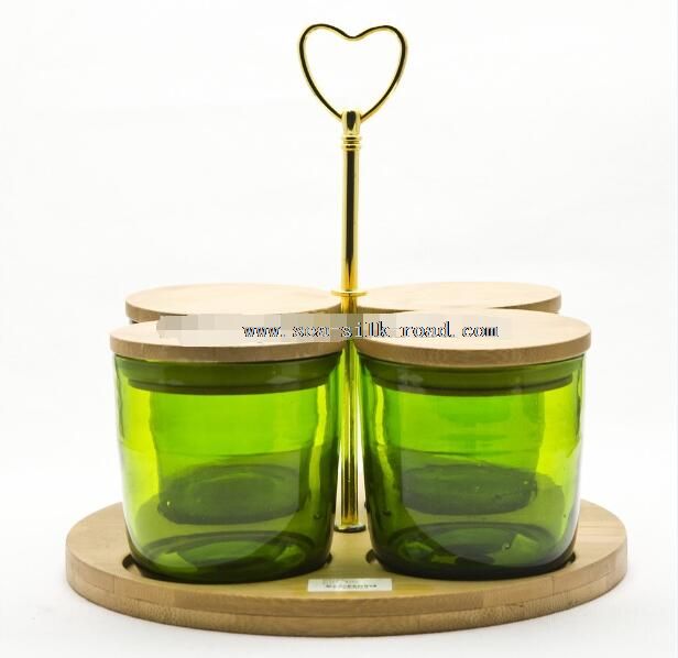 green glass candle jar with the wooden cover